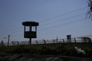 A watch tower stands empty inside Litoral Penitentiary, Guayaquil, Ecuador, July 22, 2021 (AP photo by Dolores Ochoa).