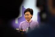 Hong Kong Chief Executive Carrie Lam listens to a reporter’s question during a press conference in Beijing, Dec. 22, 2021 (AP photo by Mark Schiefelbein).