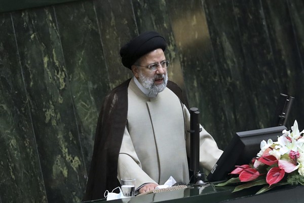 Iranian President Ebrahim Raisi addresses a joint session of lawmakers and Cabinet members in the parliament, Tehran, Iran, Dec. 1, 2021 (AP photo by Vahid Salemi).