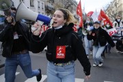 Youths demonstrate in Paris after French unions called for strikes and protests to demand more government aid for those struggling financially because of the pandemic, Feb. 4, 2021 (AP photo by Thibault Camus).