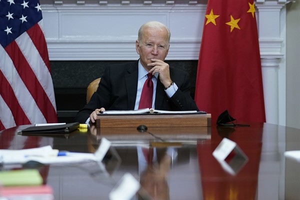 U.S. President Joe Biden listens as he meets virtually with Chinese President Xi Jinping from the Roosevelt Room of the White House in Washington, Nov. 15, 2021 (AP photo by Susan Walsh).