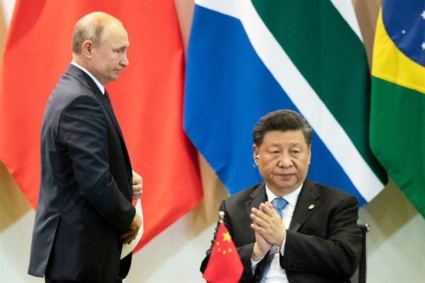 Chinese President Xi Jinping, right, and Russian President Vladimir Putin during the BRICS summit in Brasilia, Brazil, Nov. 14, 2019 (AP photo by Pavel Golovkin).