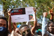 Demonstrators in a government-sponsored rally hold up signs reading, “France Out,” “Mali is proud of its sons” and “Thank you Colonel Assimi Goita,” Bamako, Mali, Jan. 14, 2021 (AP photo by Harandane Dicko).