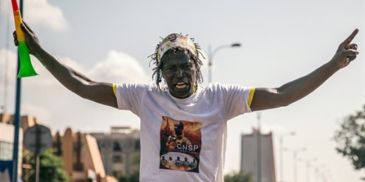A supporter wearing a T-shirt showing Col. Assimi Goita, head of the junta that staged the Aug. 18 coup and now Mali’s interim president, in Bamako, Mali, Sept. 25, 2020 (AP photo).