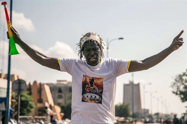 A supporter wearing a T-shirt showing Col. Assimi Goita, head of the junta that staged the Aug. 18 coup and now Mali’s interim president, in Bamako, Mali, Sept. 25, 2020 (AP photo).