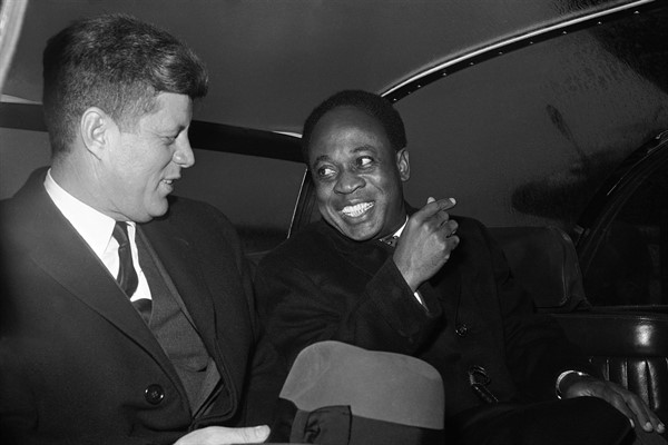 U.S. President John F. Kennedy and President Kwame Nkrumah of Ghana talk as they sit in a limousine at Washington National Airport on March 8, 1961 (AP photo).