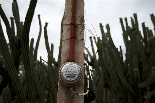 A Federal Electricity Commission, or CFE, electric meter is attached to a pole in San Jeronimo Xayacatlan, Mexico, June 24, 2020 (AP file photo by Fernando Llano).