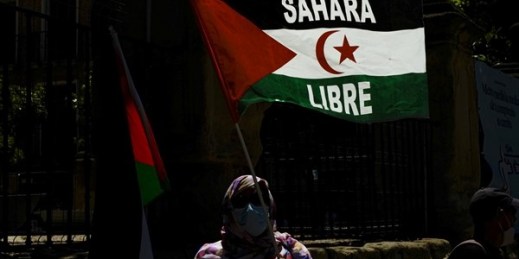 A supporter of the Polisario Front and Western Sahara waves a flag reading “Free Sahara,” Logrono, Spain, June 8, 2021 (AP photo by Alvaro Barrientos).