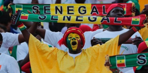 A Senegalese soccer fan holds up a scarf during the African Cup of Nations final match between Algeria and Senegal in Cairo International stadium in Cairo, Egypt, July 19, 2019 (AP Photo by Hassan Ammar).