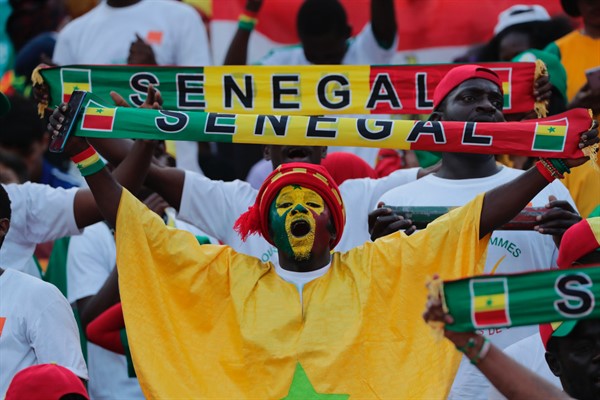 A Senegalese soccer fan holds up a scarf during the African Cup of Nations final match between Algeria and Senegal in Cairo International stadium in Cairo, Egypt, July 19, 2019 (AP Photo by Hassan Ammar).