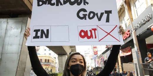A protester holds a placard during a demonstration demanding the then-prime minister step down, Kuala Lumpur, Malaysia, July 31, 2021 (AP photo by FL Wong).