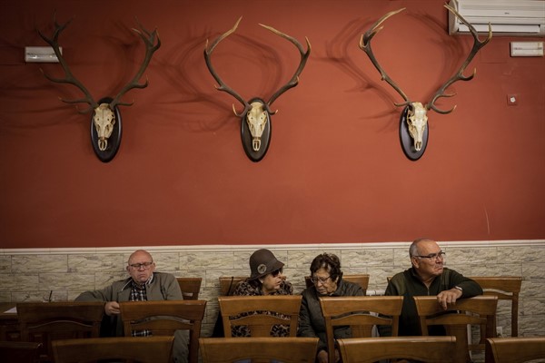 Villagers attend a campaign meeting for the Spanish far-right party Vox at a bar in Brazatortas, on the edge of the Alcudia valley, central Spain, April 10, 2019 (AP photo by Bernat Armangue).
