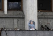 A portrait of former Kazakhstan President Nursultan Nazarbayev is seen at the city hall building after clashes in the central square in Almaty, Kazakhstan, Jan. 10, 2022 (AP photo by Vasily Krestyaninov).