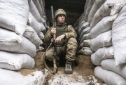 A Ukrainian soldier in the trench, on the line of separation from pro-Russian rebels, Mariupol, Donetsk region, Ukraine, Jan. 21, 2022 (AP photo by Andriy Dubchak).