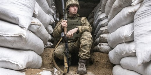 A Ukrainian soldier in the trench, on the line of separation from pro-Russian rebels, Mariupol, Donetsk region, Ukraine, Jan. 21, 2022 (AP photo by Andriy Dubchak).