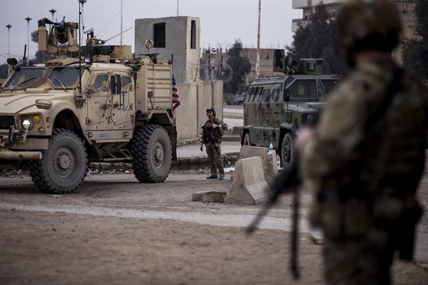 U.S. soldiers stand guard in Hasaka, northeast Syria, Jan. 27, 2022 (AP photo by Baderkhan Ahmad).