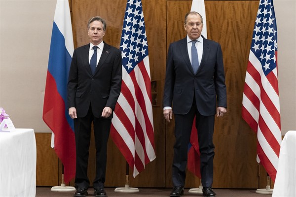 U.S. Secretary of State Antony Blinken stands with Russian Foreign Minister Sergey Lavrov before their meeting, Jan. 21, 2022, Geneva, Switzerland (AP photo by Alex Brandon).