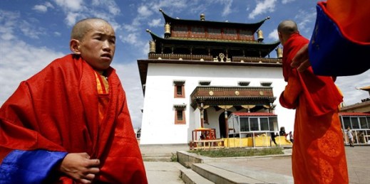 Tibetan Buddhist lamas stand outside Mongolia's largest monastery, Gandantegchinlen, where the Dalai Lama is expected to visit, in Ulaanbaatar, Mongolia Aug. 21, 2006 (AP photo by Vincent Yu).