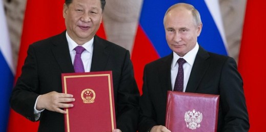 Russian President Vladimir Putin and Chinese President Xi Jinping exchange documents during a signing ceremony following their talks in the Kremlin in Moscow, Russia, June 5, 2019 (AP file photo by Alexander Zemlianichenko).