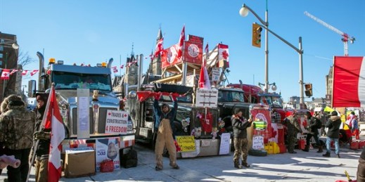 Parked trucks block lanes of traffic during a protest against pandemic restrictions in Ottawa, Ontario, Feb. 14, 2022 (AP photo by Ted Shaffrey).