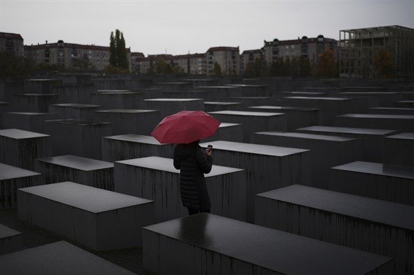 A woman visits the Memorial to the Murdered Jews of Europe, also known as the Holocaust Memorial, Berlin, Germany, Nov. 1, 2021 (AP photo by Markus Schreiber).
