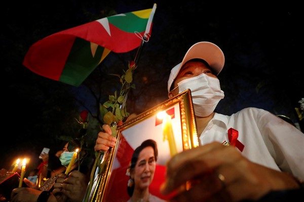 Myanmar nationals living in Thailand attend a candlelight vigil for those who died in protests against Myanmar’s military coup, in front of the United Nations building in Bangkok, Thailand, March 4, 2021 (AP photo by Sakchai Lalit).