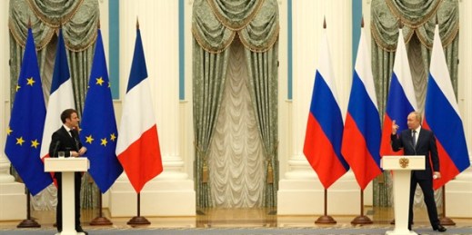 Russian President Vladimir Putin gestures during a joint press conference with French President Emmanuel Macron after their talks in Moscow, Feb. 7, 2022 (AP photo by Thibault Camus).