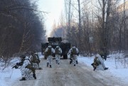 Ukrainian armed forces conduct exercises in the abandoned city of Pripyat, Ukraine, Feb.4, 2022 (AP photo by Mykola Tymche).