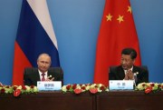 Chinese President Xi Jinping and Russian President Vladimir Putin at a joint press conference during the Shanghai Cooperation Organization Summit in Qingdao, China, June 10, 2018 (AP photo by Dake Kang).