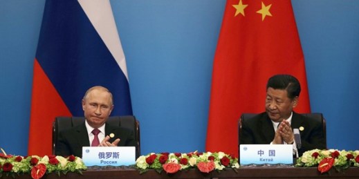 Chinese President Xi Jinping and Russian President Vladimir Putin at a joint press conference during the Shanghai Cooperation Organization Summit in Qingdao, China, June 10, 2018 (AP photo by Dake Kang).