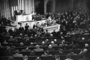 U.S. President Harry S. Truman, standing at podium, addresses a joint session of Congress in the House Chamber in Washington, D.C., March 12, 1947 (AP Photo).