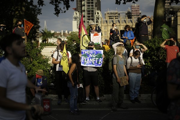 Demonstrators take part in an Extinction Rebellion climate change protest in Parliament Square, London, Sept 1, 2020 (AP photo by Matt Dunham).