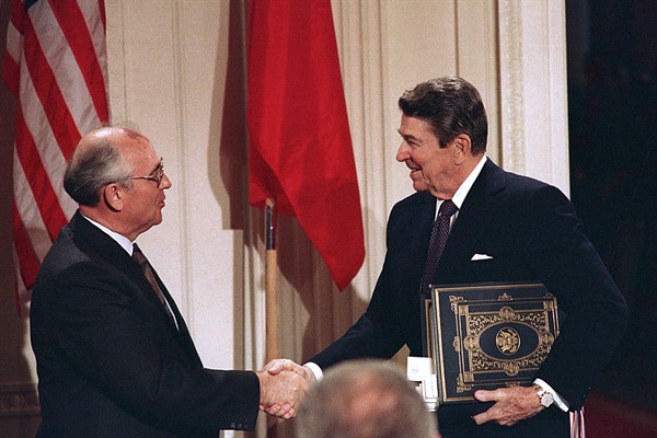Then-President Ronald Reagan shakes hands with then-Soviet leader Mikhail Gorbachev after the two leaders signed the Intermediate Range Nuclear Forces Treaty in the White House East Room in Washington, Dec. 8, 1987 (AP photo by Bob Daugherty).