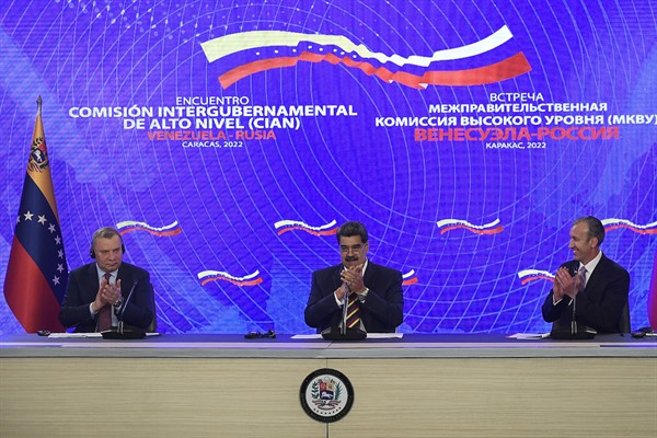 Russian Deputy Prime Minister Yuri Borisov and Venezuelan President Nicolas Maduro attend a signing ceremony at the Presidential Palace in Caracas, Venezuela, Feb. 16, 2022.