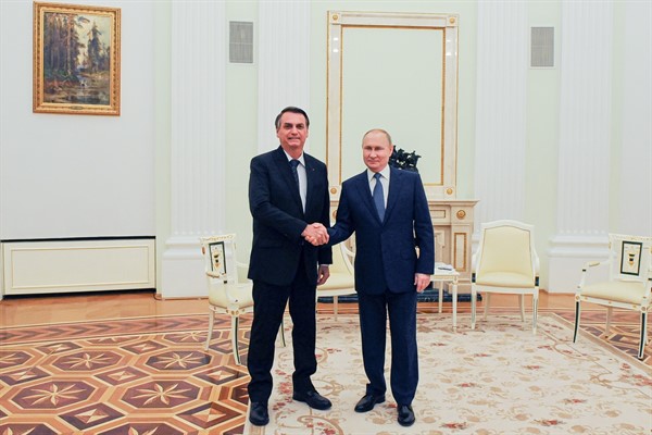 Russian President Vladimir Putin, right, and Brazilian President Jair Bolsonaro pose for a photo during their meeting in the Kremlin in Moscow, Russia, Wednesday, Feb. 16, 2022 (Sputnik photo by Mikhail Klimentyev).