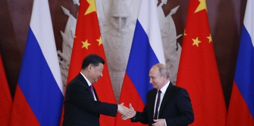 Russian President Vladimir Putin and Chinese President Xi Jinping shake hands after a signing ceremony in Moscow, Russia, June 5, 2019 (AP photo by Alexander Zemlianichenko).