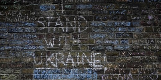 Messages protesting against the war in Ukraine chalked on the wall surrounding the Russian Embassy in London, March 11, 2022 (AP photo by Frank Augstein).