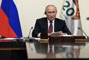 Russian President Vladimir Putin attends the G20 summit hosted by Saudi Arabia via video conference at the Novo-Ogaryovo residence outside Moscow, Russia, Nov. 21, 2020 (Sputnik photo by Alexei Nikolsky via AP).