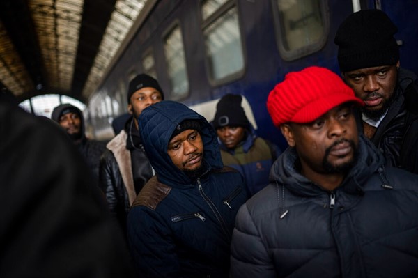 African residents in Ukraine wait at the platform inside Lviv railway station, Lviv, Ukraine, Feb. 27, 2022 (AP photo by Bernat Armangue).