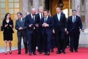 French President Emmanuel Macron speaks with European Council President Charles Michel as they walk to a group photo in Versailles, March 10, 2022 (AP photo by Michel Euler).