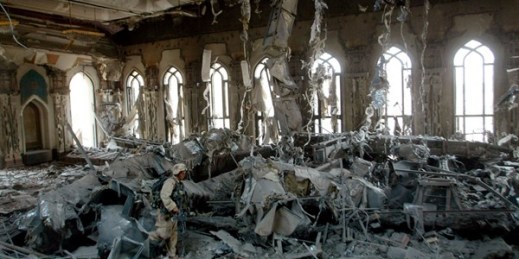U.S. Army soldiers search one of Saddam Hussein’s palaces damaged after a bombing, in Baghdad, April 7, 2003 (AP photo by John Moore).
