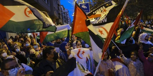 People wave Polisario Front flags while taking part in a demonstration in support of the Polisario Front and a free Western Sahara, Pamplona, Spain, March 23, 2022 (AP photo by Alvaro Barrientos).
