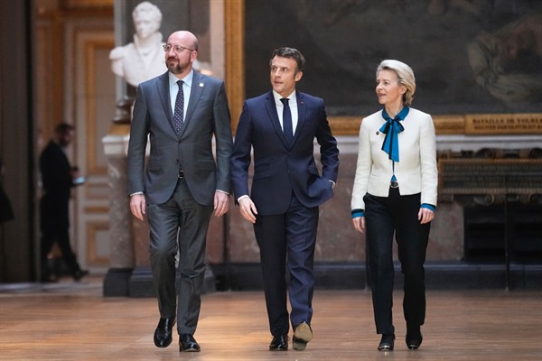 President of the European Council Charles Michel, left, French President Emmanuel Macron and European Commission President Ursula von der Leyen arrive for a press conference in Versailles, March 11, 2022 (AP photo by Michel Euler).