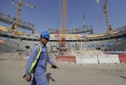 Workers work at Lusail Stadium, one of the 2022 World Cup stadiums, in Lusail, Qatar, Dec. 20, 2019 (AP photo by Hassan Ammar).