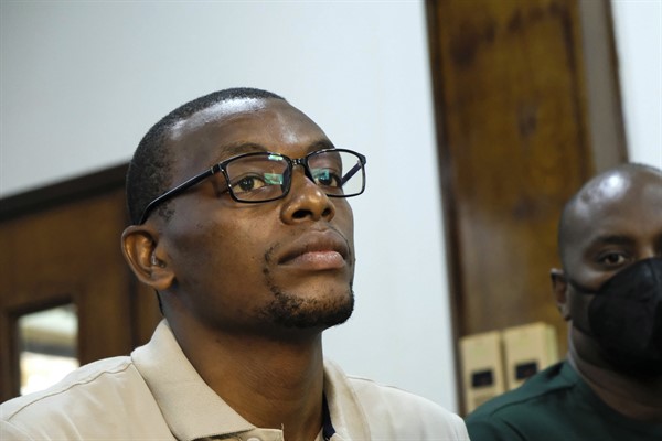 Kakwenza Rukirabashaija, who says he was tortured for weeks while in detention, appears before a court in a failed bid to have his passport returned so he could seek medical treatment abroad, Feb. 1, 2022 (AP photo by Hajarah Nalwadda).
