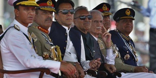 Pakistani Prime Minister Imran Khan, third from left, and top military officials attend a military parade to mark Pakistan National Day in Islamabad, Pakistan, March 23, 2022 (AP photo by Anjum Naveed).