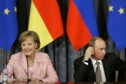 Russian President Vladimir Putin listens as German Chancellor Angela Merkel answers a question during the news conference at the Russia-EU Summit in Volzhsky Utyos, May 18, 2007 (AP photo by Alexander Zemlianichenko).