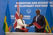 British Home Secretary Priti Patel shakes hands with Rwandan Minister of Foreign Affairs Vincent Biruta after signing what the two countries called an “economic development partnership” in Kigali, Rwanda, April 14, 2022 (AP Photo by Muhizi Olivier).