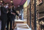 French President Emmanuel Macron looks at Beninese art during a ceremony for the return of 26 works to Benin, with Benin Culture Minister Roselyne Bachelot-Narquin, at the Quai Branly Museum-Jacques Chirac, Paris, October 27, 2021 (Sipa via AP Images).
