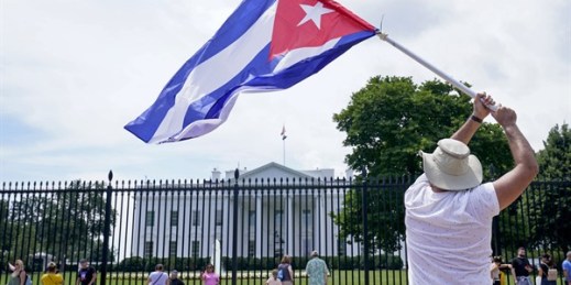 A man waving a Cuban flag in a rally outside the White House in Washington, July 13, 2021 (AP photo by Susan Walsh).